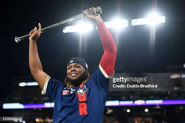 Vladimir Guerrero Jr. #27 of the Toronto Blue Jays celebrates after being awarded the MVP during the 91st MLB All-Star Game at Coors Field on July...
