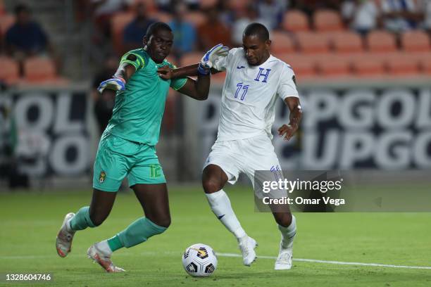 Jerry Bengtson of Honduras and goalkeeper Reice Charles Cook of Grenada fight for the ball during a Group D match as part of the 2021 CONCACAF Gold...