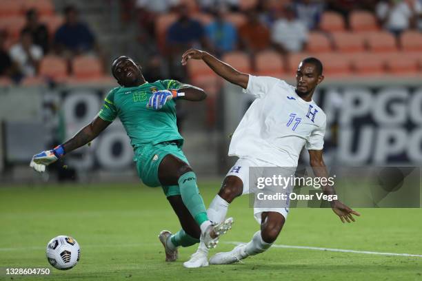 Jerry Bengtson of Honduras and goalkeeper Reice Charles Cook of Grenada fight for the ball during a Group D match as part of the 2021 CONCACAF Gold...