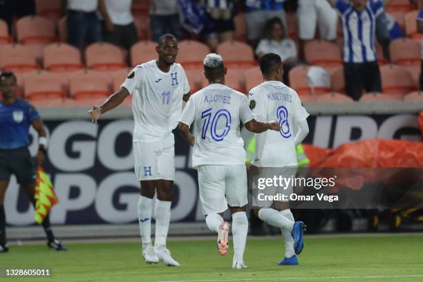 Jerry Bengtson of Honduras celebrates with his teammate Alexander Lopez after scoring 1st goal during a Group D match between Honduras and Grenada as...