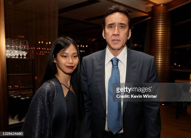 Nicolas Cage and Riko Shibata pose at the after party for the premiere of Neon's "Pig" at Craft Restaurant on July 13, 2021 in West Los Angeles,...