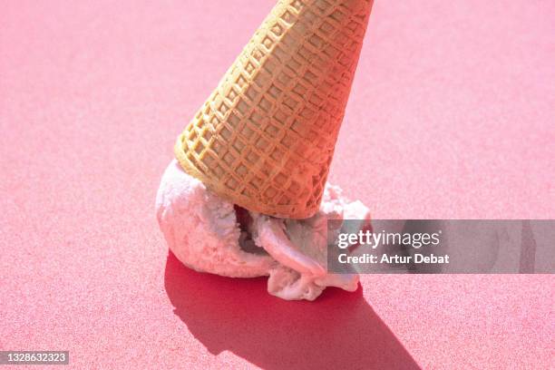 misfortune picture of ice cream cone fallen in the street floor. - melting stock pictures, royalty-free photos & images