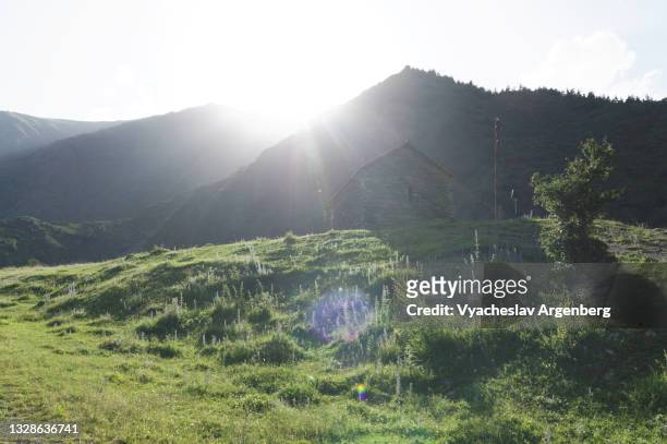 sun over mountains, caucasus mountains, georgia - argenberg stock pictures, royalty-free photos & images