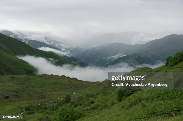 heavy clouds over abudelauri valley, caucasus mountains, georgia - argenberg stock pictures, royalty-free photos & images