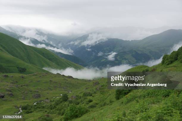 clouds over abudelauri valley, caucasus mountains, georgia - argenberg stock pictures, royalty-free photos & images