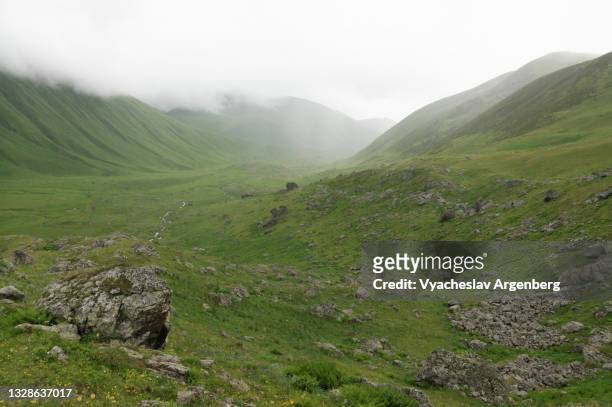 clouds and fog in the mountains, abudelauri valley, georgia - argenberg stock pictures, royalty-free photos & images