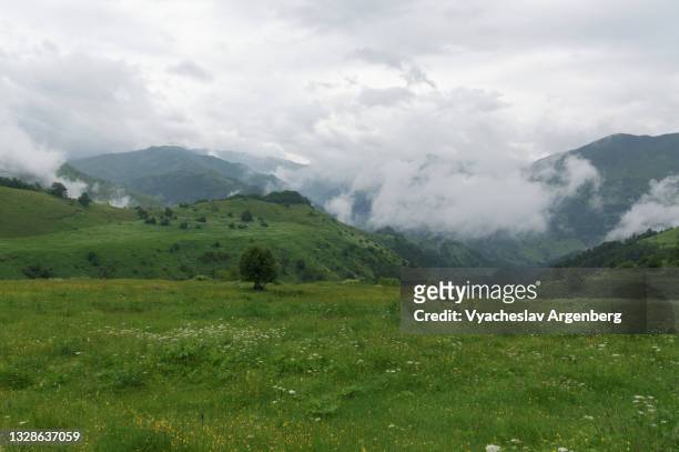 clouds over abudelauri valley, north caucasus, georgia - argenberg stock pictures, royalty-free photos & images
