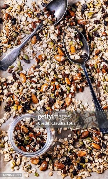 granola on parchment paper - savory stock-fotos und bilder