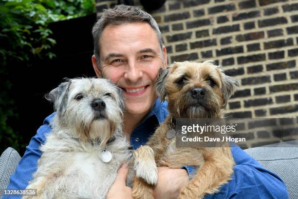 In this image released on July 14th, David Walliams poses with his dogs to mark his book "Mega Monster" being number one in the best selling charts...