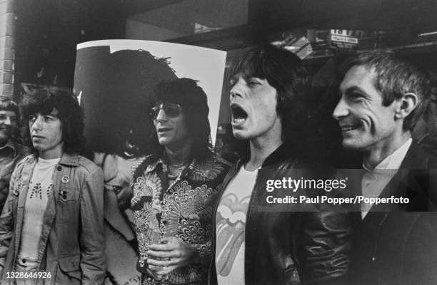 From left, Bill Wyman, Ronnie Wood, Mick Jagger and Charlie Watts of English rock group The Rolling Stones posed together outside The Marquee Club in...