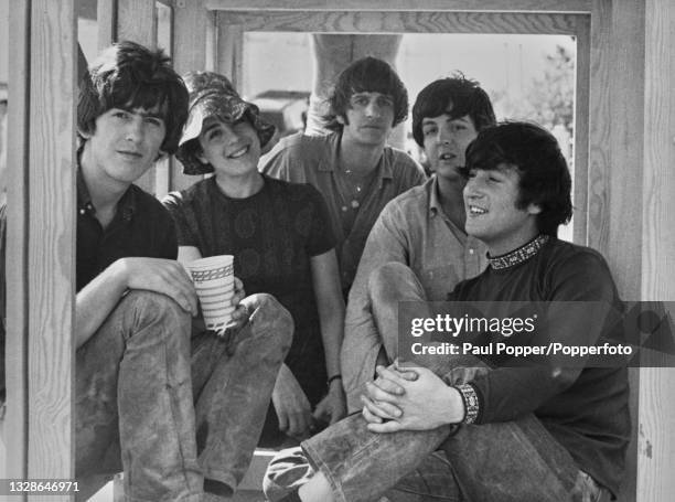 From left to right, George Harrison , Ringo Starr, Paul McCartney and John Lennon of English pop group The Beatles posed together with actress...