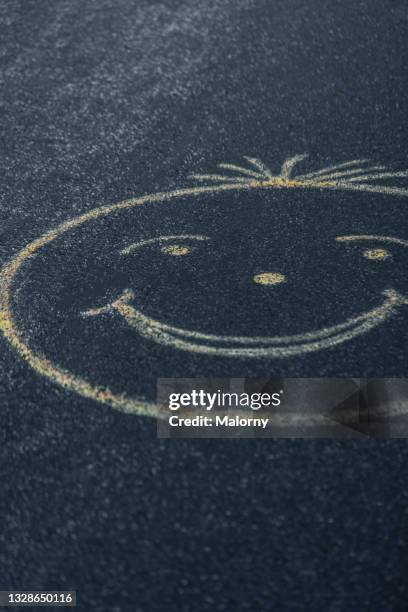 smiley face on asphalt. - dead body street stock pictures, royalty-free photos & images