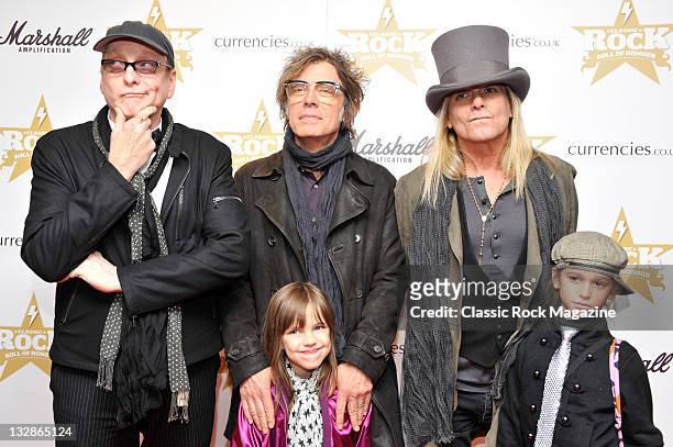 Rick Nielsen, Tom Petersson and Robin Zander of Cheap Trick arriving on the red carpet for the Classic Rock Awards, taken on November 10, 2010.