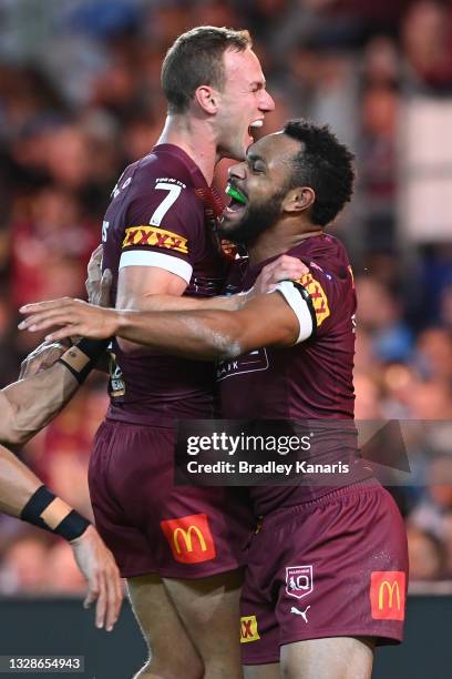 Hamiso Tabuai-Fidow of the Maroons celebrates with Daly Cherry-Evans of the Maroons after scoring a try during game three of the 2021 State of Origin...