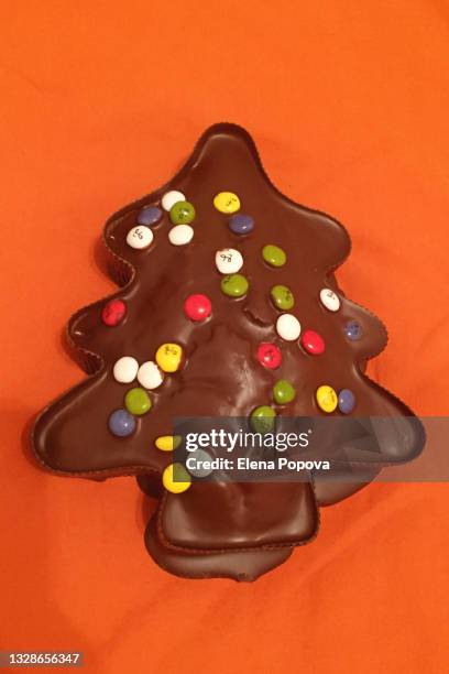 homemade chocolate christmas cake with colourful candy toppings - almond cookies stock pictures, royalty-free photos & images