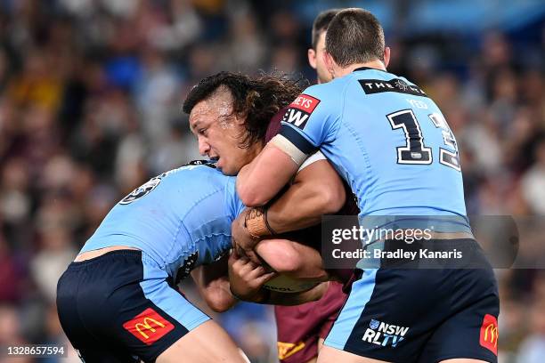 Josh Papalii of the Maroons is tackled during game three of the 2021 State of Origin Series between the New South Wales Blues and the Queensland...