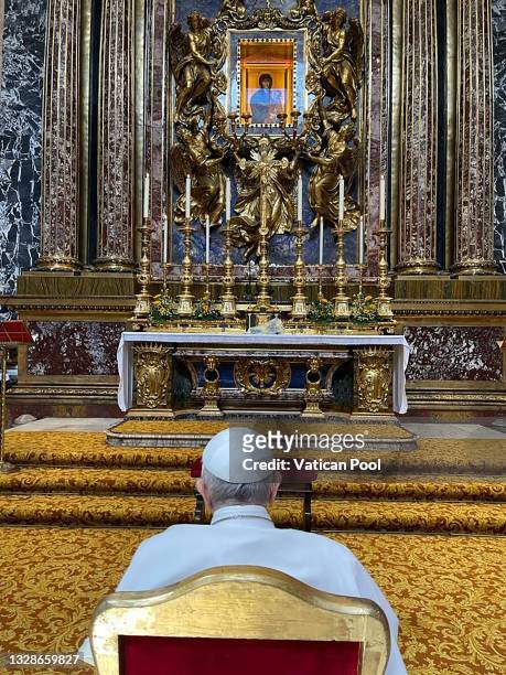 In this photograph provided by the Holy See Press Office, Pope Francis prays before the icon of the Virgin Mary Salus Populi Romani at the Basilica...