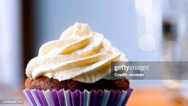 chocolate cupcake with white cream - cream cake stock pictures, royalty-free photos & images