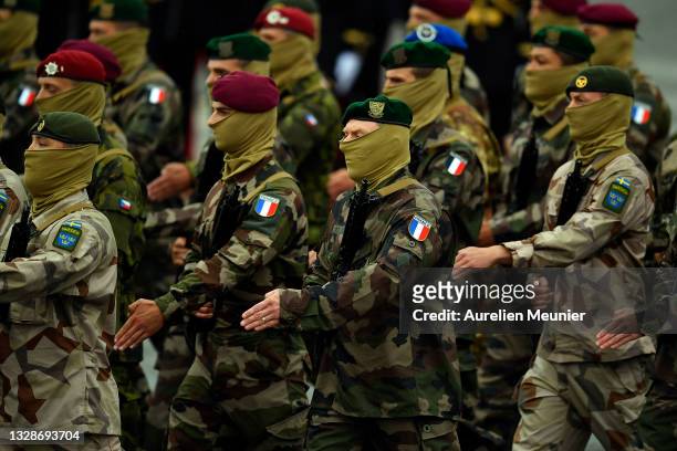European special forces march during Bastille Day Military parade on July 14, 2021 in Paris, France. This year some 4404 men on foot, 221 motorized...
