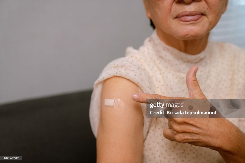Asian senior woman receive covid-19 anti virus vaccine in campaign.