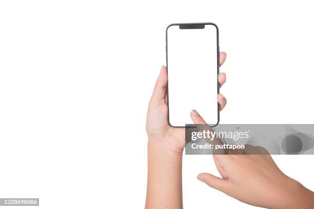 close up of woman hand holding smartphone on white background, cropped hand using smartphone on the background white - toccare foto e immagini stock