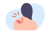 Back view of woman with upper back and shoulder pain or injury.