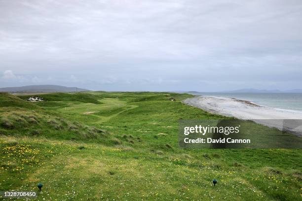 View of the par 4, seventh hole at Askernish Golf Club on the island of South Uist with the Island of Eriksay in teh distance in The Outer Hebrides...