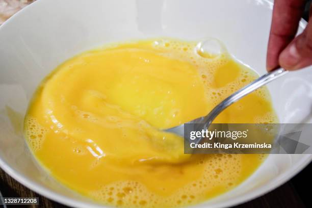 beaten eggs - egg yolk stock pictures, royalty-free photos & images