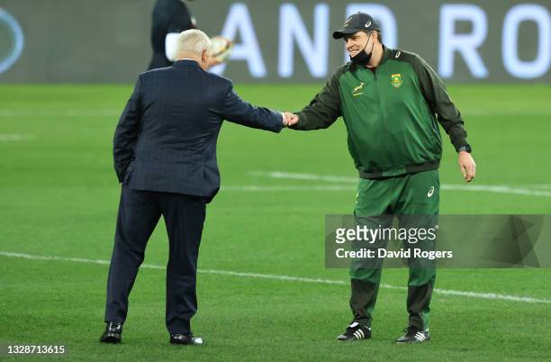 South Africa coach Rassie Erasmus greets Warren Gatland before the match between South Africa A and the British and Irish Lions at Cape Town Stadium...