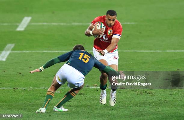 British & Irish Lions wing Anthony Watson runs at South Africa A full back Willie Le Roux during the match between South Africa A and the British and...