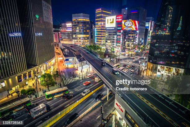 the boundary and intersections of busy business district yurakucho (有楽町) and ginza (銀座) at night, in tokyo (東京) japan - 東京 imagens e fotografias de stock