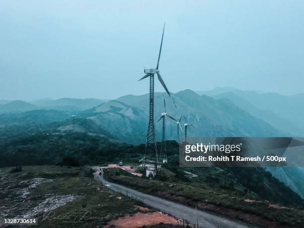 high angle view of road amidst mountains against sky,idukki twp,kerala,india - renewable energy india stock pictures, royalty-free photos & images