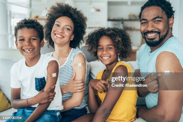 portrait of a vaccinated family - blocked nose stock pictures, royalty-free photos & images