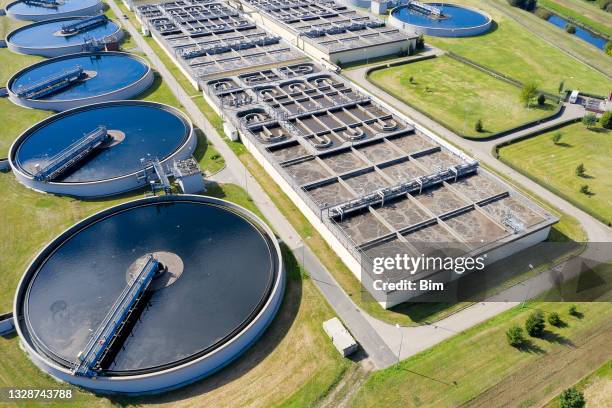 modern sewage treatment plant, aerial view - águas residuais imagens e fotografias de stock