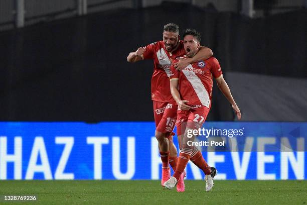 Gabriel Hauche of Argentinos Juniors celebrates with teammate Jonathan Sandoval after scoring the first goal of his team during a round of sixteen...