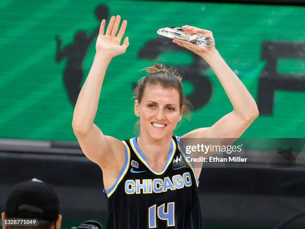 Allie Quigley of the Chicago Sky holds up a trophy after winning the 3-Point Contest during halftime of the 2021 WNBA All-Star Game at Michelob ULTRA...