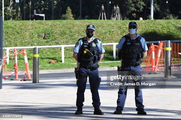 Police officers guard a media conference given by the Premier of New South Wales on July 15, 2021 in Sydney, Australia. Lockdown restrictions have...