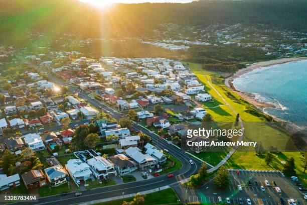 beach town, suburb, houses, sunlight, aerial view - sydney dawn stock pictures, royalty-free photos & images