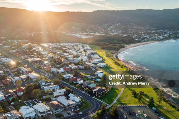 idyllic beach town, suburb, houses, sunlight, aerial view - community investment stock pictures, royalty-free photos & images
