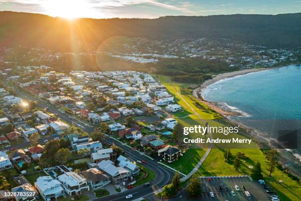 idyllic beach town, suburb, houses, sea change, sunlight, aerial view - wollongong stock pictures, royalty-free photos & images