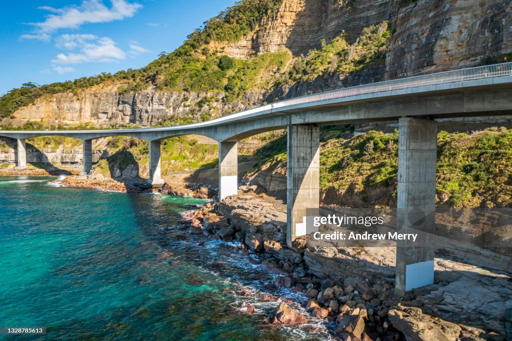 Sea Cliff Bridge, coast road, mountain and turquoise ocean