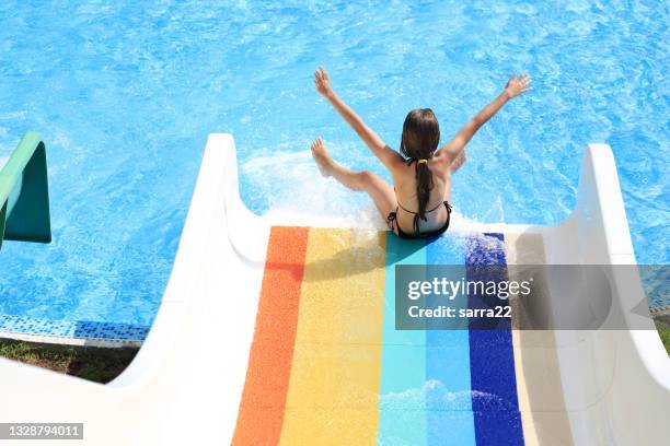 having fun in an aquapark - water slide stock pictures, royalty-free photos & images