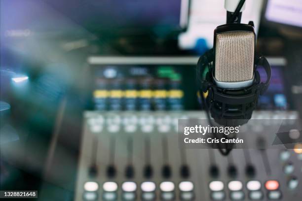 radio broadcast studio with microphone and sound mixer console on the background - radio hardware audio imagens e fotografias de stock