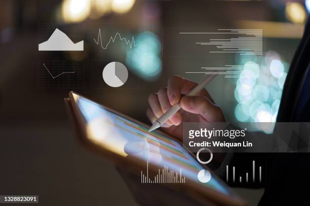 composite image of digital tablet and virtual screen - big data stock-fotos und bilder