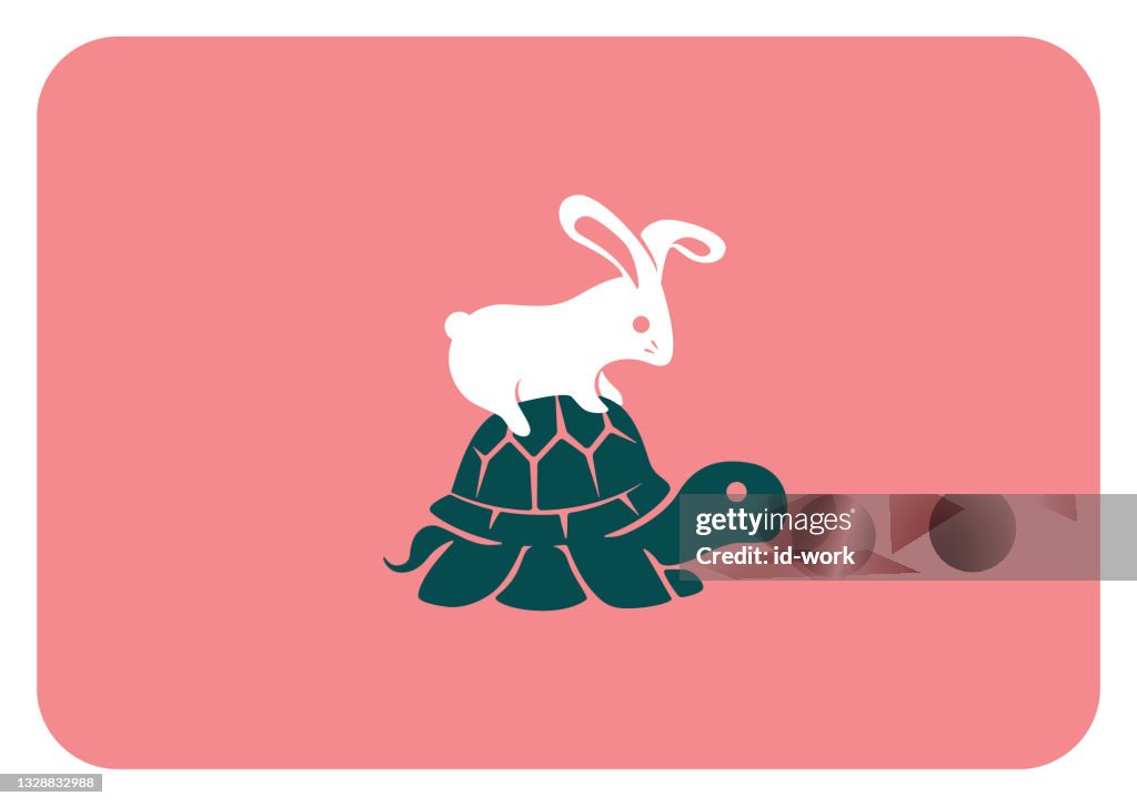 Lapin assis sur le symbole de la tortue