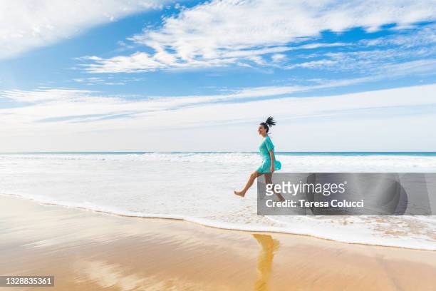 happy young woman having fun at seaside - playa canarias stock pictures, royalty-free photos & images