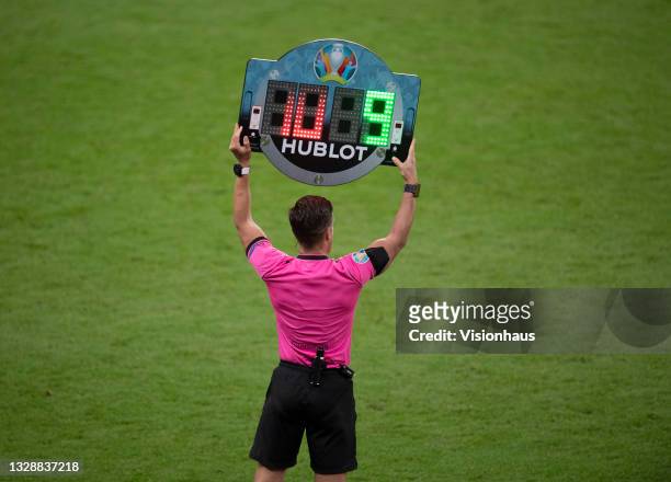 The fourth official Del Cerro Grande holds up the substitutes board during the UEFA Euro 2020 Championship Final between Italy and England at Wembley...