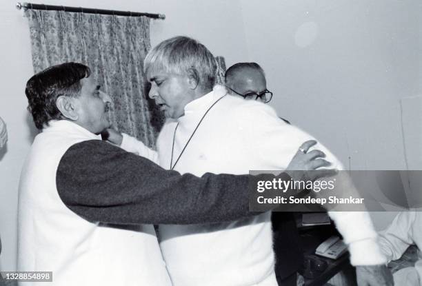 Ruling Janata Dal leaders Mulayam Singh Yadav and Lalloo Prasad share a light moment after a meeting in New delhi, India November 27, 1995.