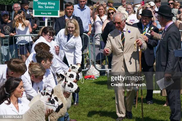 Prince Charles, Prince of Wales speaks to competitors in the sheep ring as he visits the 162nd Great Yorkshire Show on July 15, 2021 in Harrogate,...
