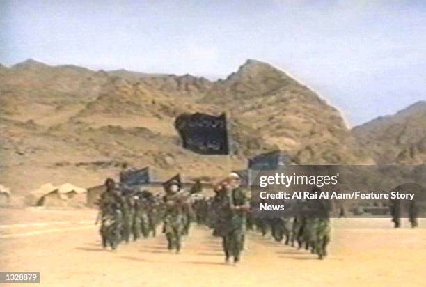 Fighters participate in military training in this undated still frame from a recruitment video for Osama bin Laden''s extremist Al-Qaida network.